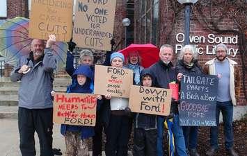 People in Owen Sound protest the Ford goverment's cuts to library services (Kirk Scott photo)