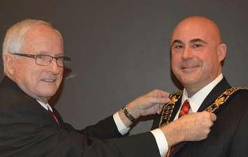 Brockton Mayor David Inglis [left] places the chain of office around the neck of Bruce County Warden Mitch Twolan.
Photo by Jordan McKinnon
