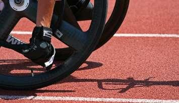 Male athlete prepares for wheelchair race. © Can Stock Photo Inc. / jpavan