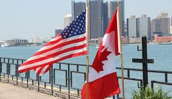 U.S. and Canadian flags along Windsor's riverfront.  (Photo by Melanie Borrelli.)