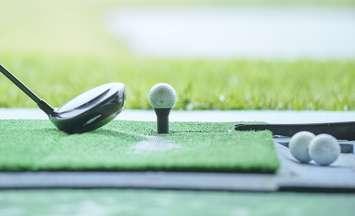 Golfer practicing indoors (Image by west / iStock / Getty Images Plus via Getty Images)