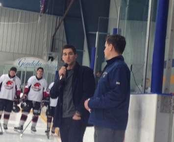 Aaron Armstrong, holding the microphone, thanking the fans prior to a Walkerton-Wingham Western jr. C game. (Photo by Steve Sabourin)