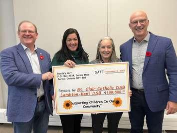 Noelle's Gift presents a cheque to two local school boards - Nov. 3/23 (L-R) John Howitt, Director of Education, Lambton Kent District School Board; Nicole Paquette and Lynn Paquette, Noelle’s Gift to Children; and Scott Johnson, Director of Education, St. Clair Catholic District School Board (Submitted photo)