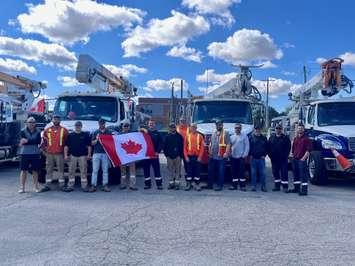  Entegrus crew, and Entegrus alongside Bluewater Power prior to joining Essex Powerlines, ERTH & E.L.K. (Photo courtesy of Entegrus)
