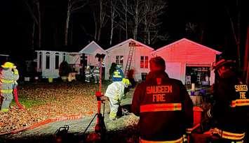 Firefighters on scene of a house fire in the area of Edison Circle and Bruce Road 13, November 13, 2024. Photo provided by Saugeen Fire and Emergency Services.