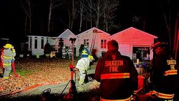 Firefighters on scene of a house fire in the area of Edison Circle and Bruce Road 13, November 13, 2024. Photo provided by Saugeen Fire and Emergency Services.