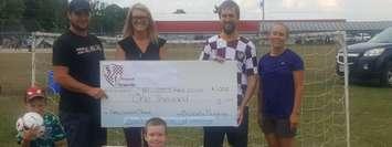 Back: Wade Stephenson, Kayla Blackburn, Tyler Jutzi of the Brussels Burgundys and Patricia Beuermann, Minor Soccer Coach. Canon Beuermann (front) (Photo provided by Nicole Duquette)