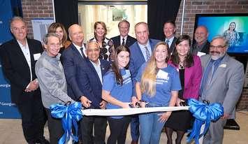 The grand opening platform party cuts the ribbon, officially opening the new Nursing and Wellness Wing at Georgian College’s Owen Sound Campus. Pictured from left to right, front row: Warden Selwyn Hicks, Hana Plantt, Katrina Brown; middle row: Rob Cordell, Steve Lowe, Kevin Weaver, Sheila West, Fred Varkaris; back row: MPP Rick Byers, MPP Natalie Pierre, Sara Lankshear, Bill Van Wyck, Mayor Ian Boddy, and Gary Sims.
Photo courtesy of Georgian College.
