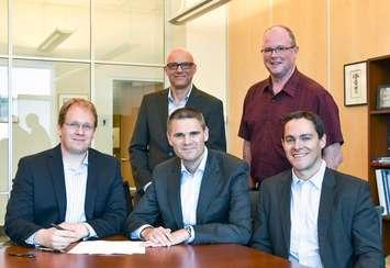 Mark Harfensteller, (seated at left) Managing Director Production, F&E, Engineering, SSI for Isotopen Technologien München (ITM), signs a Memorandum of Understanding with James Scongack, (front middle) Bruce Power’s Vice President of Corporate Affairs & Environment, to explore the production of the medical radioisotope Lutetium-177 in Bruce Power’s reactors.
Also in the photo is (front right) Pat Dalzell, Senior Strategist, Bruce Power Corporate Affairs;  Ingo Russnak, Supply Chain Manager, ITM;  and Kurt Wigle, Bruce Power’s Department Manager, Waste Management and Isotopes. (Bruce Power photo)