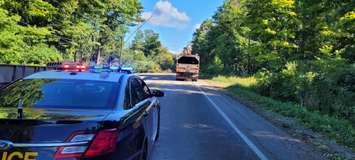 Crews cleaning up damage on Bruce Road 13 following the major storm on September 7th, 2021. (Provided by Grey Bruce OPP)