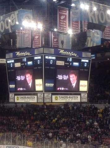 A tribute to Detroit Red Wings and Tigers owner Mike Ilitch is placed on the big screen at Joe Louis Arena in Detroit on Feb 10, 2017, before the University of Michigan-Michigan State University hockey game (Photo courtesy of Erik Zarins)