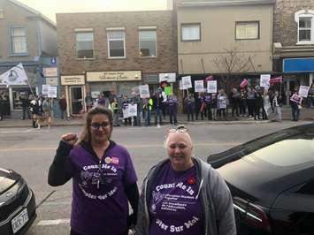 Regional Communications Lead for CUPE 1176, Emily Cole, and President of local 3447 Shirley Bushell stand in front of a large crowd at Huron Bruce MPP Lisa Thompson’s constituency office in downtown Kincardine, protesting the provincial government’s new law that imposes contracts on education workers and banned them from striking.