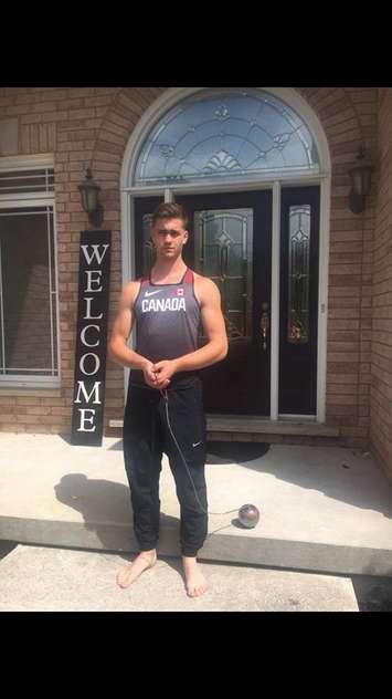 Ryan Jacklin, 16, in front of his home in June of 2018 getting ready for his first international track and filed meet in Jamaica. (Photo courtesy of the Jacklin's)