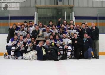 Bill Brown, in the front row, points to the camera after the Wingham Ironmen won the 2014 Western Junior C championship. (Courtesy of Wingham Ironmen)