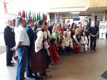 Representatives from all the "villages" in the 44th Carrousel of the Nations pose with Windsor Mayor Drew Dilkens at the Windsor International Aquatic and Training Centre, June 4, 2019. Photo by Mark Brown/Blackburn News.