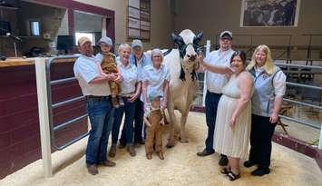 Welane Fuel Carrot (EX-91) which sold for $10,000. From left to right: James Fullerton, Hudson Heibein, Margo Carson, David Carson, Lori Carson, Tyler Heibein, Bailee Huygen, Haillie Heibein