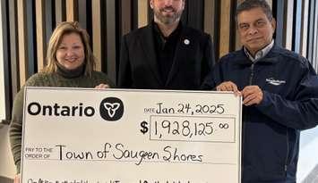 Lisa Thompson presents a cheque for the HECS funding to Saugeen Shores. Left to right: Huron-Bruce MPP Lisa Thompson, Mayor Luke Charbonneau, Ruhul Amin, Manager, Engineering Services