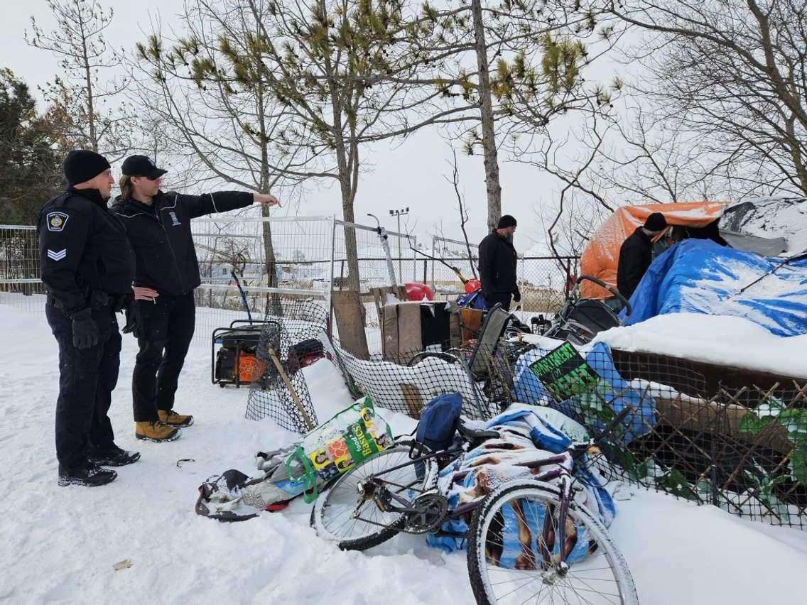 Police and City of Sarnia Bylaw Officers begin the final cleanup at Rainbow Park (Photo courtesy of Sarnia Police Service)