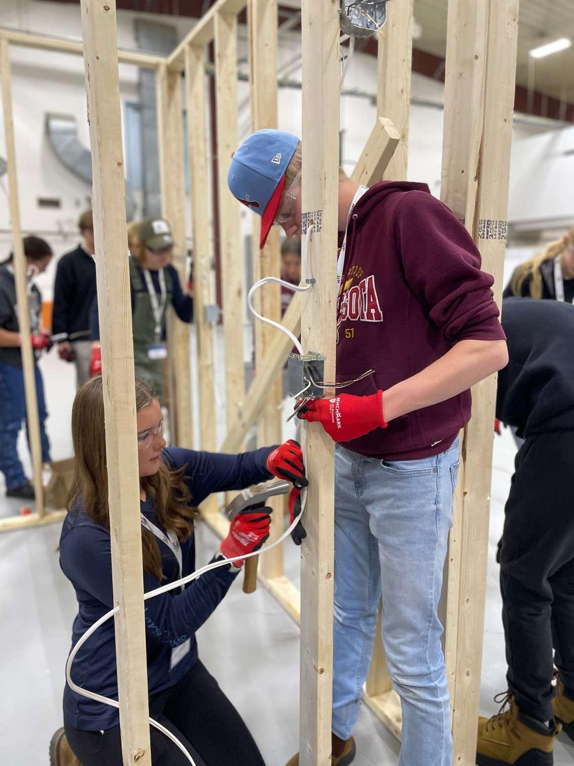 Students wire light switches during electrical training with the Canadian Union Of Skilled Workers (CUSW). Photo submitted by NII