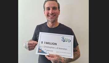 Christopher Lucas of Alvinston claims $1 Million Lotto Max prize. Image courtesy of OLG.