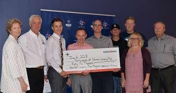 (Left to right)  Bruce County CAO Kelley Coulter, Wilfred Laman (Lion’s Head Beach Motel & Cottages, Lion’s Head), Zachary Bolton (Zachary Bolton, RMT, Port Elgin), Dave Cook (F.I.G. Studio Kitchen, Ripley), Trevor Anderson (Timber Trevor, Lion’s Head), Adam Dietz (Freestyle Cartel, Kincardine), Brian Carson (By the Bay, Pike Bay, North Bruce Peninsula), Sarah Farrell (Farrell’s Pick Your Own, Ripley), Bruce County Warden Paul Eagleson. 
Not pictured are grant recipients: Tassja Martin (Sweetwater Hair & Bodyworks, Wiarton) and Kathleen Shipman (Lighthouse Pizza and Ice Cream Shop, Ripley) (Photo submitted)


