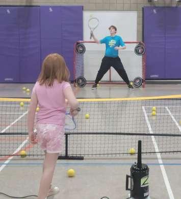 A child learns tennis through Tennis4Kids (Photo via t4ksarnia.com)