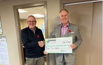 Dan Stringer, Chair of the Board of Gateway CERH, receives a cheque from Ian Murray of CIBC Wealth Management.