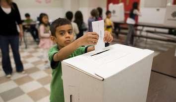 A student participates in a mock vote as part of the Student Vote program run by CIVIX. Submitted photo.