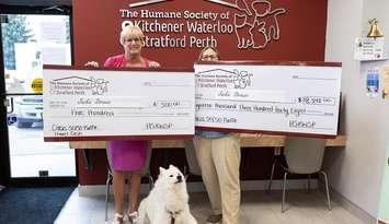 Jackie Strauss receives her winnings from the Humane Society of Kitchener Waterloo and Stratford Perth's 50/50 draw. Photo provided by Humane Society of Kitchener Waterloo and Stratford Perth