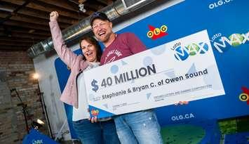 Stephanie and Bryan Cantwell pose with a prop cheque for $40-million, their half of the record Lotto Max jackpot from the September 17 draw. Photo courtesy of OLG. 