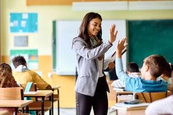 Elementary teacher with student