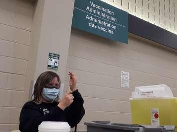 Public Health Nurse Jill Seara drawing up doses of Pfizer's COVID vaccine at the Mount Brydges Vaccination Clinic. 18 February 2021. (BlackburnNews.com photo by Colin Gowdy)
