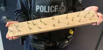 Saugeen Shores Police found this board hidden in the sand along a travelled area of Port Elgin's Main Beach. Photo courtesy of Saugeen Shores Police Service.
