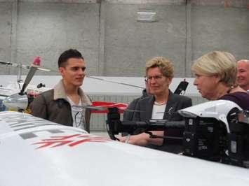 Premier Kathleen Wynne and Deputy Premier Deb Matthews learn about drones from Fanshawe College student Nikola Zivkovic at the Norton Wolf School of Aviation Technology, January 24,2017. (Photo by Miranda Chant, Blackburn News.)