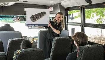 A Bruce Power Visitors’ Centre staffer speaks to people on a bus tour of the facility. Photo provided by Bruce Power.