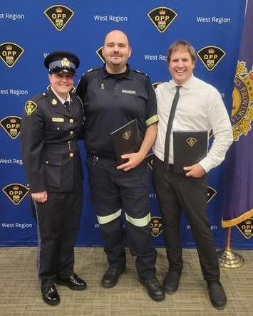 Paramedics Jim Ainslie and Justin Boucher are joined by OPP Detective Constable Melissa Laki at OPP awards ceremony (Image courtesy of the County of Bruce)