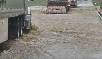 Heavy flooding on Highway 402 - July 16, 2024 (Photo courtesy of OPP West Region via X)