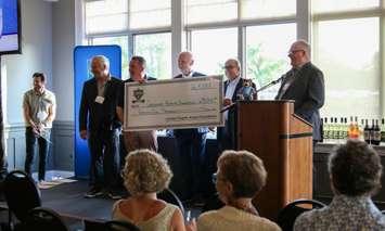 L-R: Dale Hunter, Children's Health Foundation President Scott Fortnum, Phil Griffin, Michael Lerner, Rick Doyle at the cheque presentation. Photo courtesy of the London Knights. 
