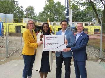 Ward 11 councillor Skylar Franke, London West MP Arielle Kayabaga, London North Centre MP Peter Fragiskatos and London Mayor Josh Morgan pose in front of an affordable housing construction project at 345 Sylvan Street, August 30, 2023. (Photo by Craig Needles, Blackburn Media)