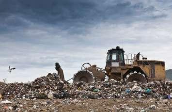 Bulldozer at garbage collection center. Walter Zerla / Image Source via Getty Images