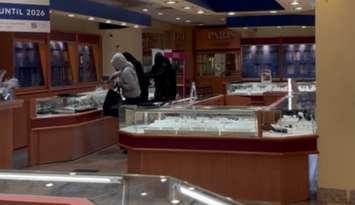 Four people smashing display cases during a robbery at Paris Jewellers at the Stratford Mall, June 22, 2025. Photo provided by the Stratford Police Service