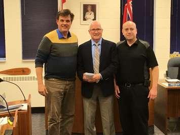  Bill Carroll, left, and Mike Wagner, right, of the Walkerton Homecoming Committee, stand with Brockton Mayor David Inglis at Brockton Council Monday night to present their final report on the successful 2016 Walkerton Homecoming weekend. (Photo by Ryan Drury, Monday, May 8th, 2017)