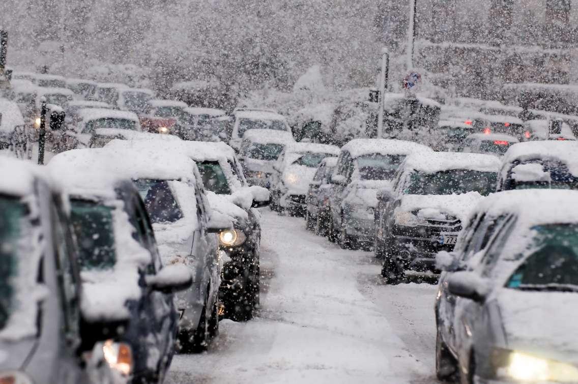 Cars in a snow storm. Snow Squall warning. 