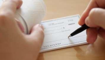 Cheque.  Photo by payphoto / iStock / Getty Images Plus via Getty Images 