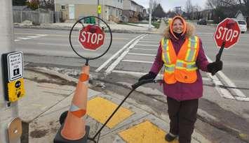 Crossing Guard Sheila Donatis welcomes new crosswalk overhead lights on Bayfield Road. Photo from Huron County OPP