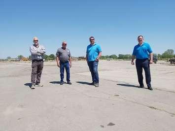 Investors Rob Myers, Don Tetrault & Mike Vagi celebrating ownership of former Navistar site along with Mayor Darrin Canniff. May 18, 2021. Photo by Paul Pedro.