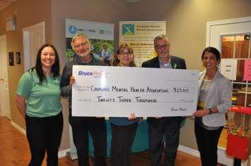 Bruce Power is donating a total of $23,000 to the Canadian Mental Health Association’s Grey Bruce branch for its Friends and Neighbours Club, Men’s Group and Ride Don’t Hide event, as part of its #BreakTheSilence campaign. From left are April Robinson, Fundraising & Event Coordinator; Joachim Ostertag, Program Manager of the Men’s Program; Jackie Ralph, Youth Awareness - FAN Club and Let's Talk program coordinator; Claude Anderson, Executive Director of the CMHA; and Christine John, Communications Specialist, Bruce Power. A total of $84,000 was donated to local mental health initiatives as part of the second annual #BreakTheSilence social media day. (Submitted photo)