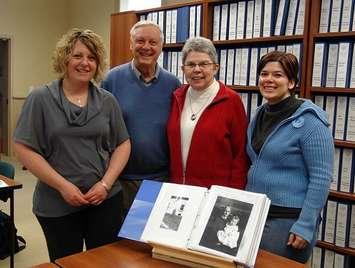 From Left:  Outdoor Education Centre Site Manager Deb Diebel,  Ron Marshall, Nancy Marshall, Archivist Ann-Marie Collins.
Photo by Kirk Scott
