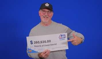 Ross Barkwell of Owen Sound shows off his lotto winnings at the OLG Prize Centre in Toronto. Photo provided by OLG.
