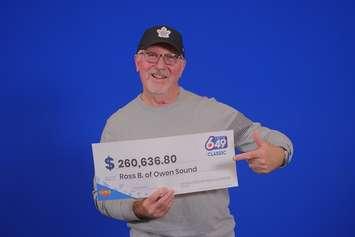 Ross Barkwell of Owen Sound shows off his lotto winnings at the OLG Prize Centre in Toronto. Photo provided by OLG.